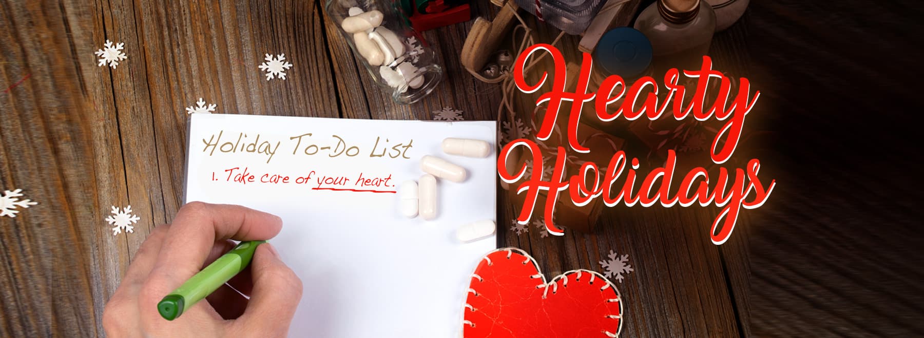 Person making a list for the holidays that says "Take care of your heart"